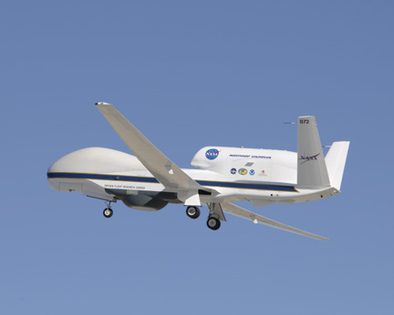 NASA's Global Hawk UAV in flight against a clear blue sky.