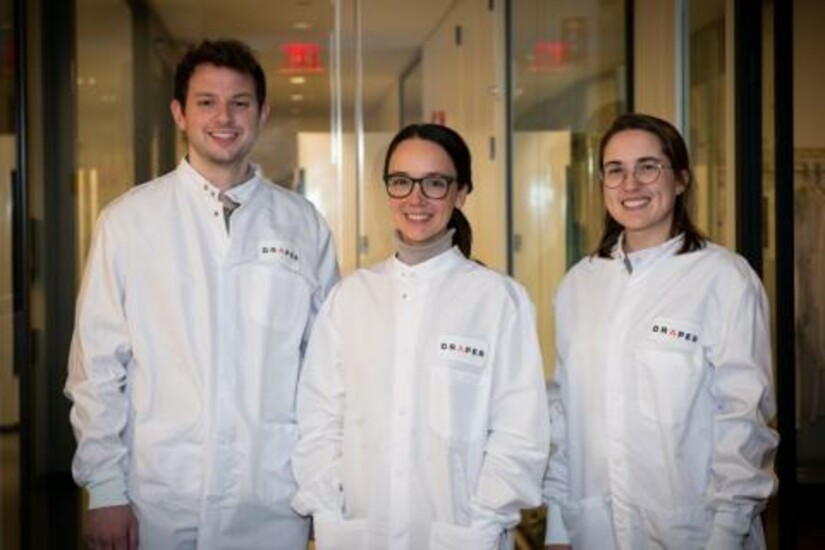 Three Draper researchers in lab coats