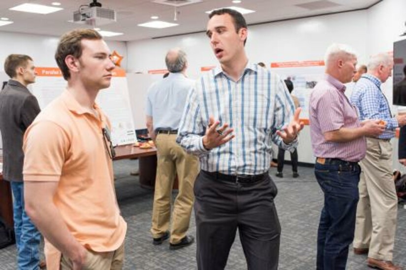 Students and mentors engage in discussions at the 2017 Draper Fellows Program graduation event.