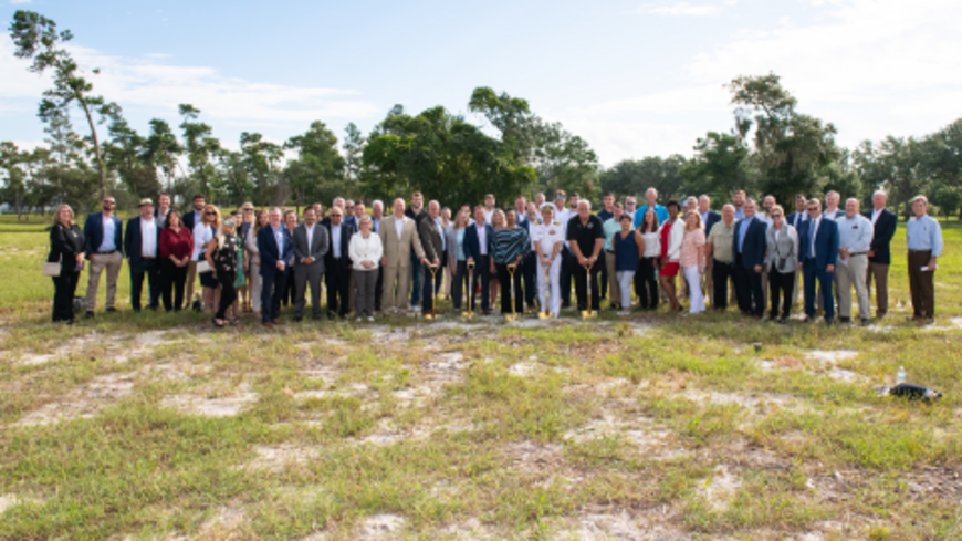 Group photo at the groundbreaking ceremony for Draper's new test facility in Titusville, Florida.