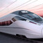 Sleek high-speed train gliding on tracks at sunset, showcasing modern design and advanced technology.