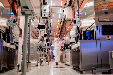 Margaret Henschel, one of the more than 50,000 Intel employees in the United States, moves through Fab 32, a high-volume manufacturing facility in Chandler, Arizona. Intel Corporation’s U.S. manufacturing and research and development facilities are in Oregon, Arizona and New Mexico. They operate 24 hours a day, 365 days a year. (Credit: Tim Herman/Intel Corporation)