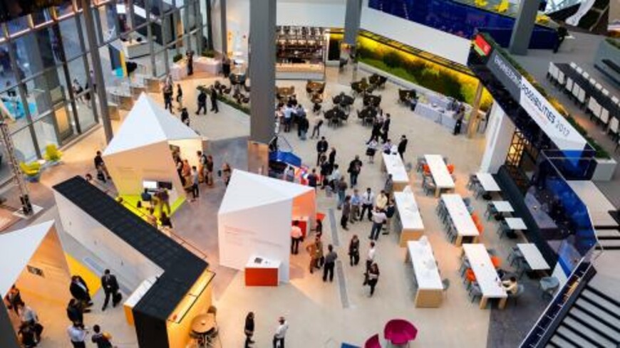 Visitors in a conference hall at EP18