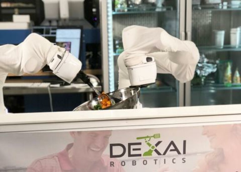 Dexai Robotics' Alfred, an AI-enabled robot, prepares food in a kitchen