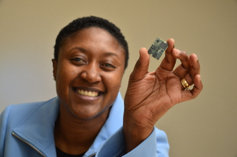 Aicha Evans, Intel's vice president and general manager of the Intel Communication and Devices Group, holds up the five-mode Intel XMM 7360 LTE Advanced solution, which supports up to Category 10 and downlink speeds of up to 450 Mbps. (Photo: Business Wire)