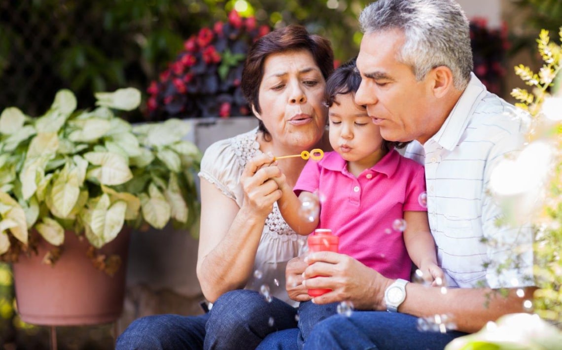 Family blowing bubbles