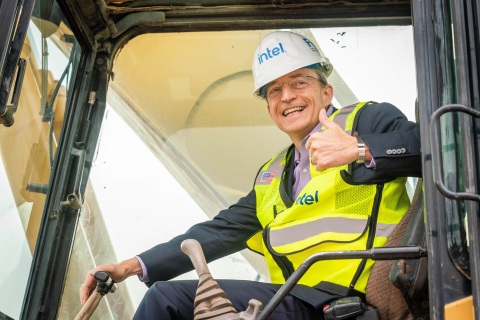 Intel CEO Pat Gelsinger signals to the crowd from earth-moving equipment in Chandler, Arizona, on Friday, Sept. 24, 2021, for a groundbreaking ceremony to celebrate the largest private-sector investment in Arizona's history. The construction of two new computer chip factories is a $20 billion project that will bolster U.S. semiconductor leadership and help bring geographical balance to the global supply chain. (Credit: Intel Corporation)