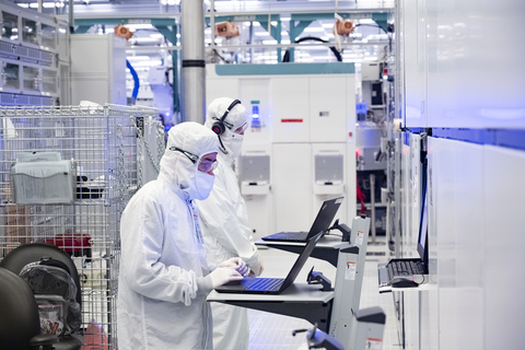 A photo from November 2021 shows employees in clean room 