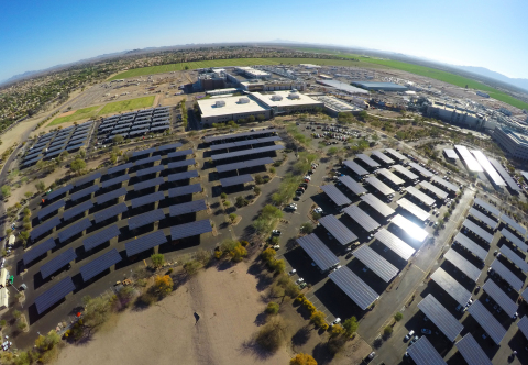 A 2017 photo shows Intel Corporation’s Ocotillo, Arizona, campus, where the company has built special solar parking structures that keep employees’ cars shaded from 100-degree summer temperatures and generate solar power for on-campus use. The company has installed more than 8,000 solar parking spots worldwide. New solar projects are planned or underway at many Intel campuses, including those in Ocotillo; Chandler, Arizona; India; Vietnam; and Malaysia. (Credit: Intel Corporation)