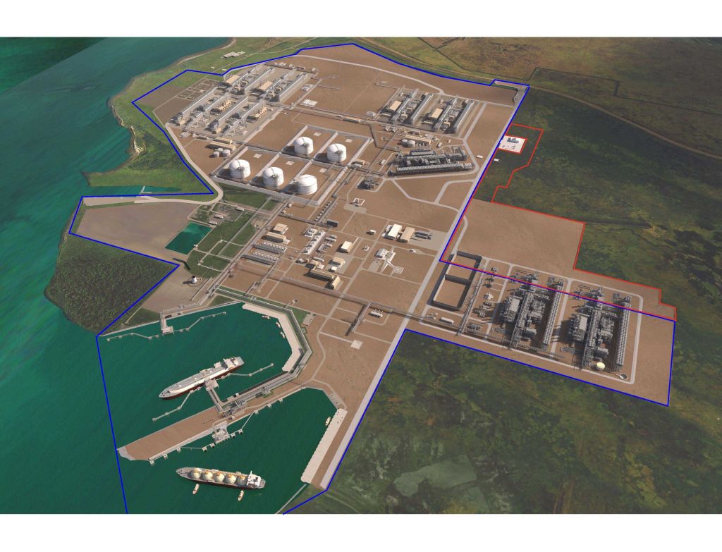 Cheniere Energy’s LNG terminal showing processing units, storage tanks, and marine docks along the coastline from an aerial view.