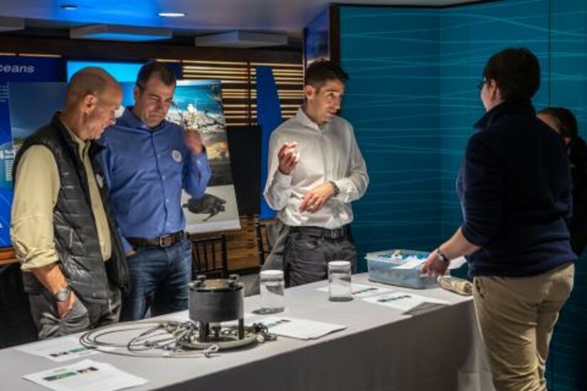 Microplastic sensor team discusses ocean microplastics with the public at New England Aquarium.