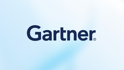 man on a mountain with hands raised in the air