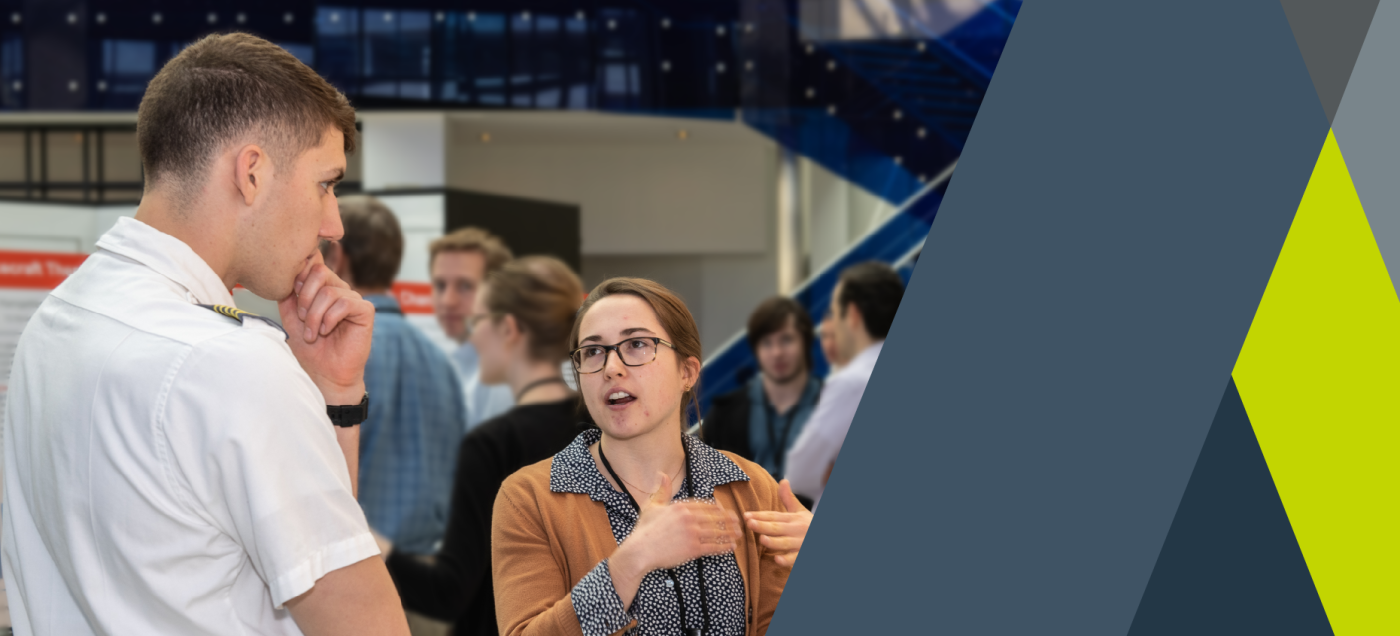 A woman describing her work to a member of the Navy
