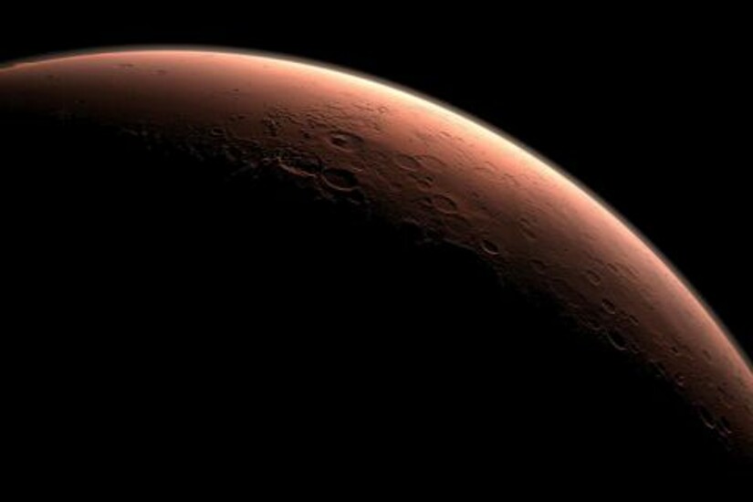 A crescent view of Mars, highlighting its surface craters and rugged terrain against the dark space.