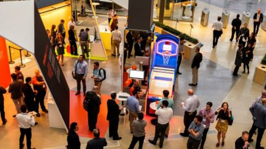 People gather at an event showcasing Draper's innovative solutions for space travel and cancer.