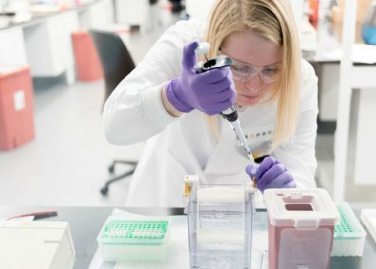 Scientist in lab working