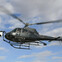 A black helicopter with registration N1231A flying against a cloudy sky.