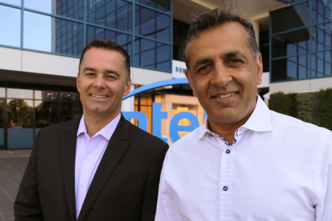 Dan McNamara (left), corporate vice president and general manager of Intel's Programmable Solutions Group, stands with eASIC CEO, Ronnie Vasishta, outside Intel Corporation headquarters in Santa Clara, California. Intel on Thursday, July 12, 2018, announced plans to acquire custom chipmaker eASIC. (Credit: Intel Corporation)