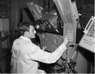Draper’s Hack the Moon website celebrates the people behind the Apollo missions in words, images and sound. Pictured is George Schmidt testing the Display Keyboard (DSKY). Image courtesy: Draper.