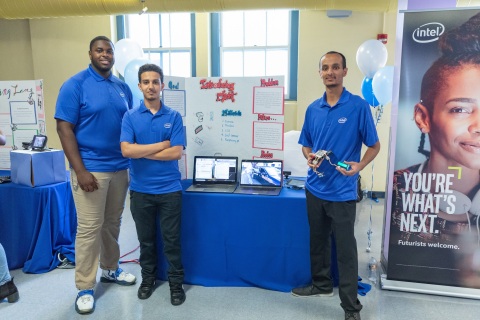 Intel interns (from left) Chibuzo Ezeokoli, Abdulhadi Hussein and Edrees Saied pose with their project DTechT, an artificial intelligence-based car-theft deterrent system. On completion of their six-week paid internships, 37 interns from Oakland Technical and McClymonds high schools presented projects, many incorporating Intel Corporation technology, to their families, schools and communities during a presentation in Oakland, Calif., on Thursday, July 26, 2018. (Credit: Intel Corporation)