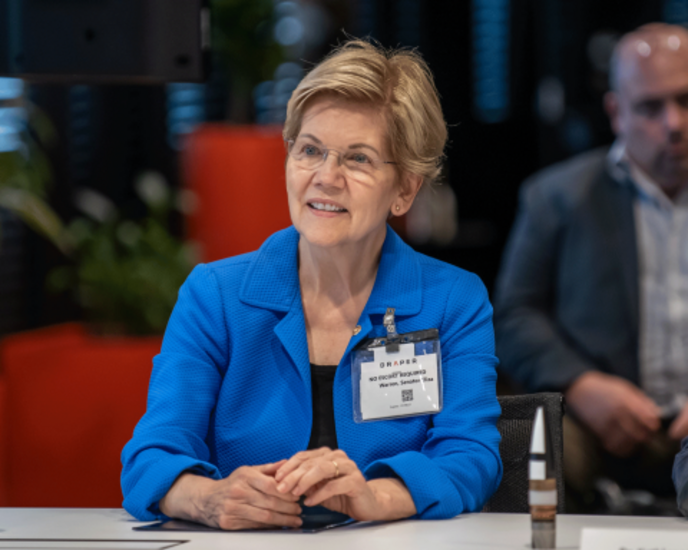 Senator Elizabeth Warren at Draper discussing national security research and development efforts.