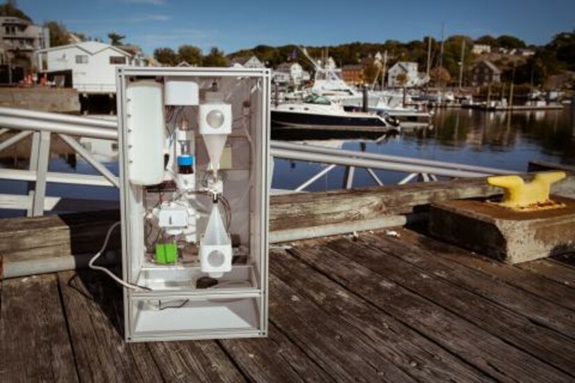 First-generation underwater microplastic sensor system on a dock in a harbor.