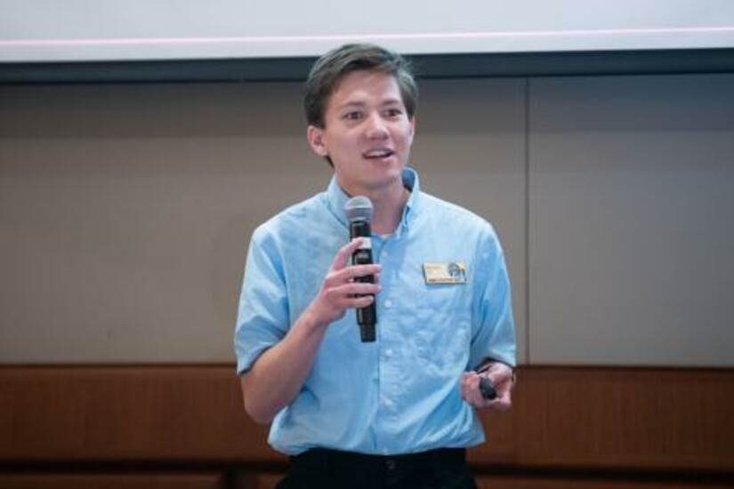Braden Oh presents research on spacecraft technology at the Draper Research Symposium.