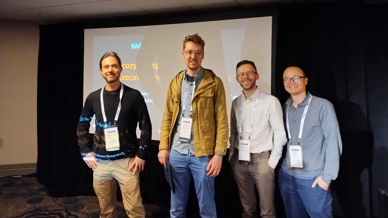 Draper’s Caleb Helbling (2nd from left) and Graham Leach-Krouse (third from left) receiving the Best Paper award at BAR 2025.