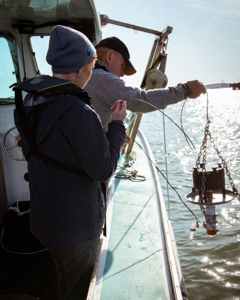 (L-R) Anna-Marie Cook and Bill Robberson of the EPA Region 9 team prepare to take water samples in Boston Harbor. Credit: Draper