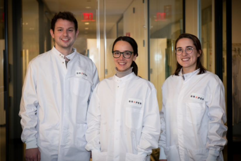 Three Draper researchers in lab coats
