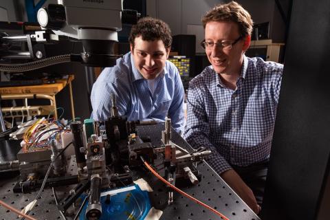 Draper engineers Daniel Goldman and Steven Spector test the beamsteering capabilities of Draper’s new LiDAR-on-a-Chip. Credit: Draper