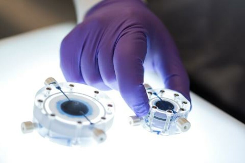 A gloved hand holds Draper's MTD