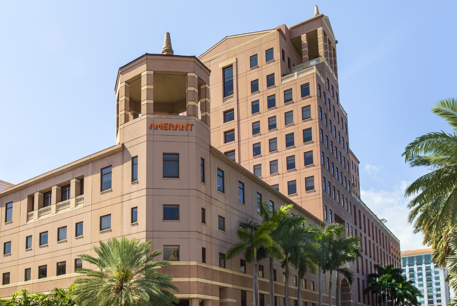 Child, Mother, and Grandmother smiling together on a couch