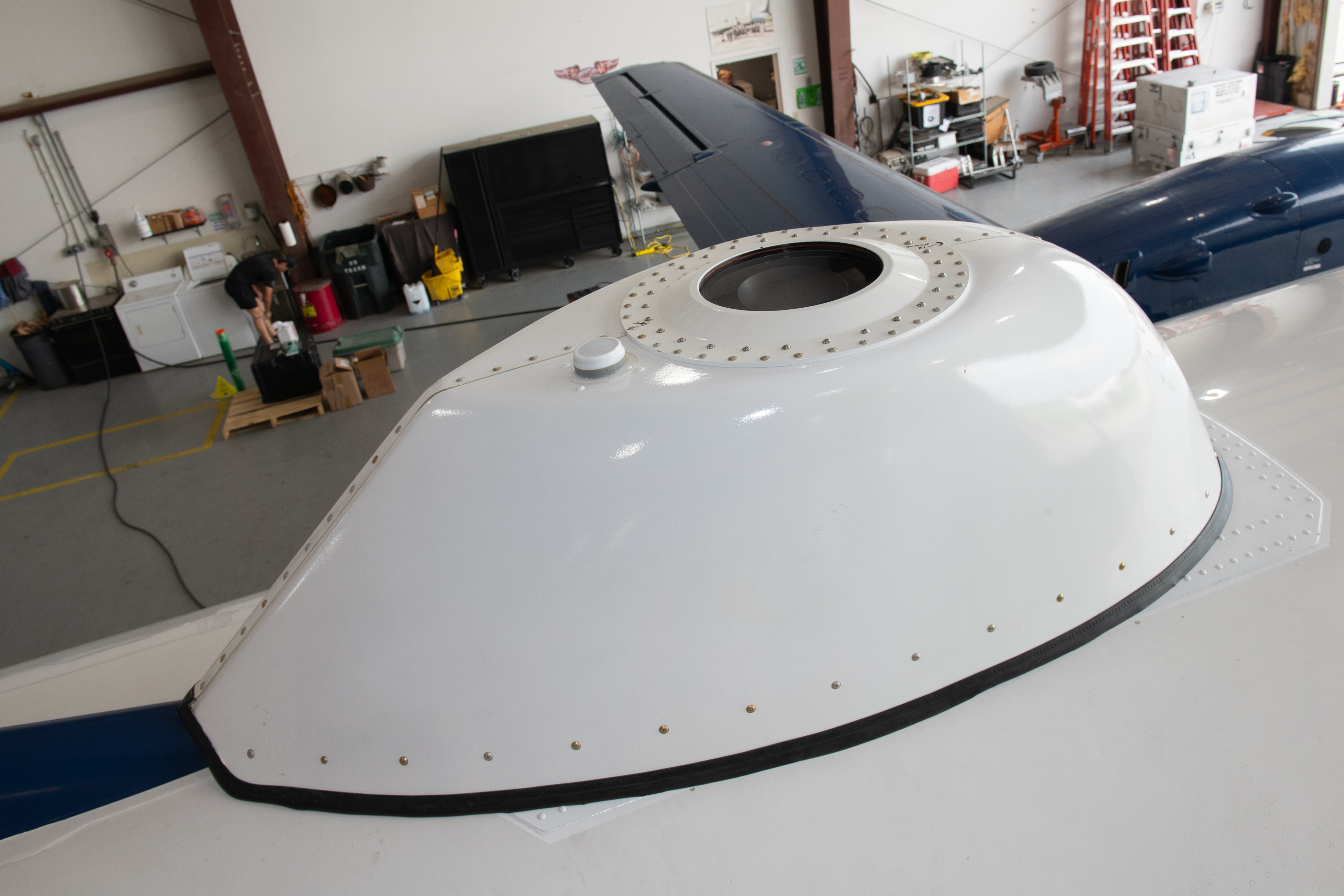 Photo of airborne CNS unit with fairing mounted to flight test aircraft.