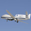 NASA's Global Hawk UAV in flight against a clear blue sky.