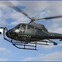 A black helicopter with a camera mounted on the front flying against a blue sky with clouds.