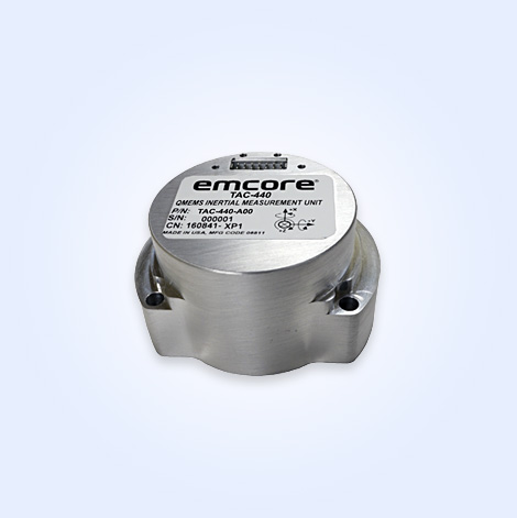 Emcore TAC-440 inertial measurement unit with a silver cylindrical design and labeled top.