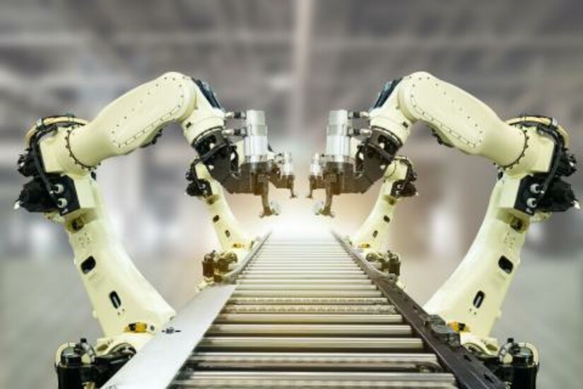 Robotic arms working on an assembly line