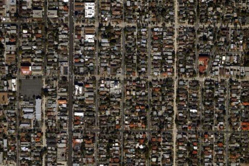 Aerial view of urban infrastructure, showing roads, buildings, and various facilities.