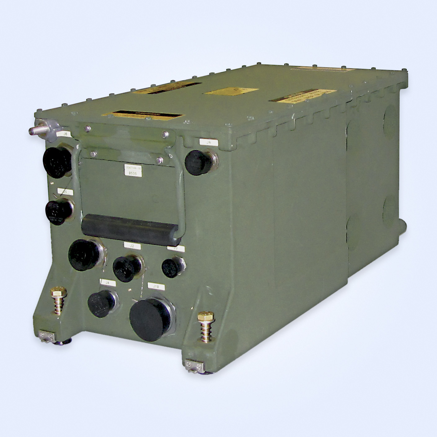 Military-grade green electronic equipment with multiple connectors, labels, and a handle on a light background.