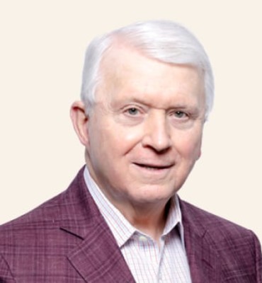 Headshot of James E. Buckman.