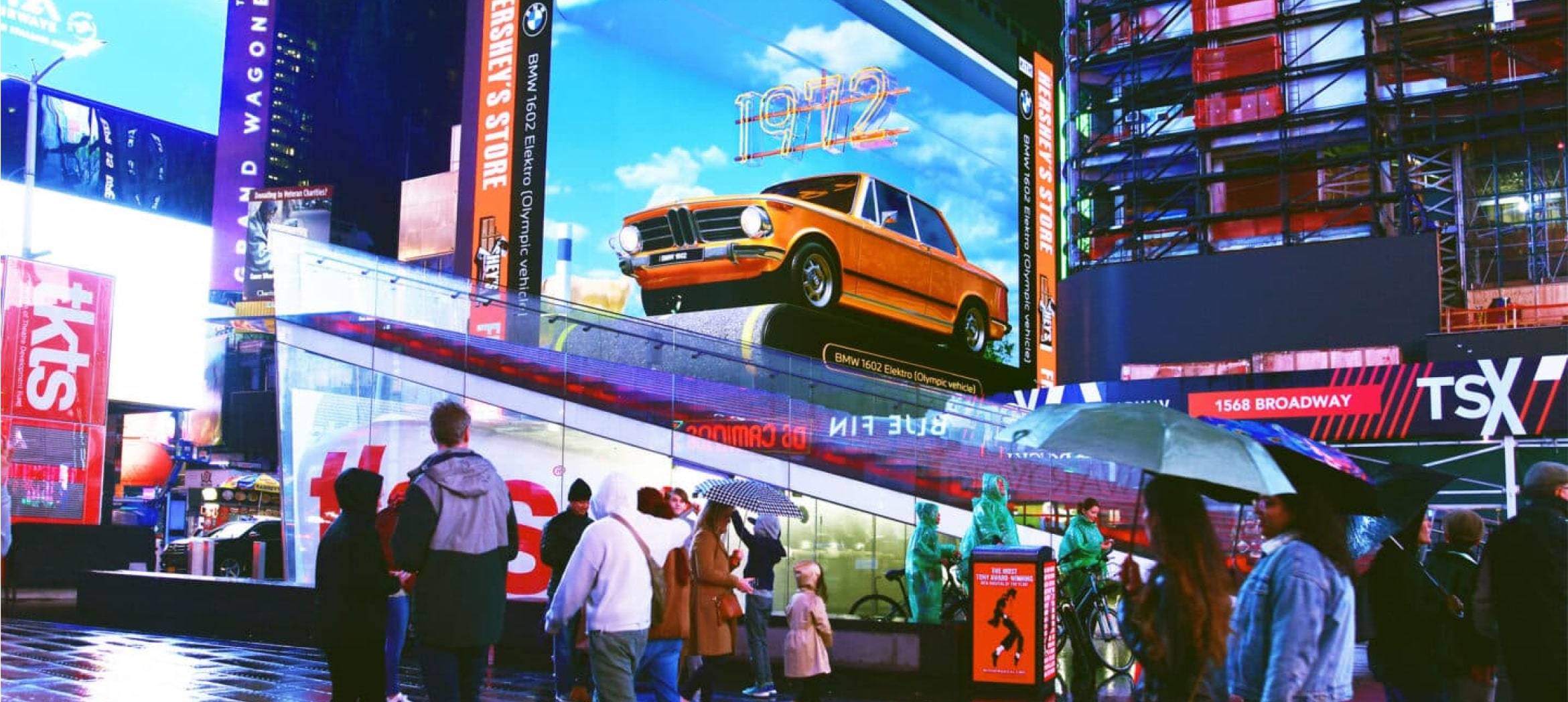 Image of a car in the middle of a city elevated, with people walking around it