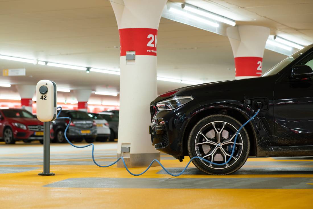 Car charging at an EV charging station