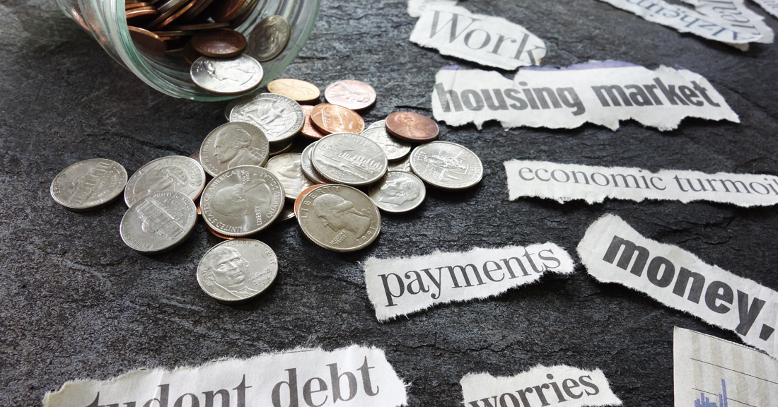 Money jar spilling over it's coins, with cutout news paper print: housing market, money, payments, work, student debt