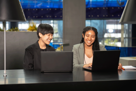 (L-R) Evelyn Chin, a Brooke Owens Fellow, and Shalayah-Naomi Webb, a Patti Grace Smith Fellow, enjoy a moment during their summer internships  in aerospace engineering at Draper. Credit: Draper.