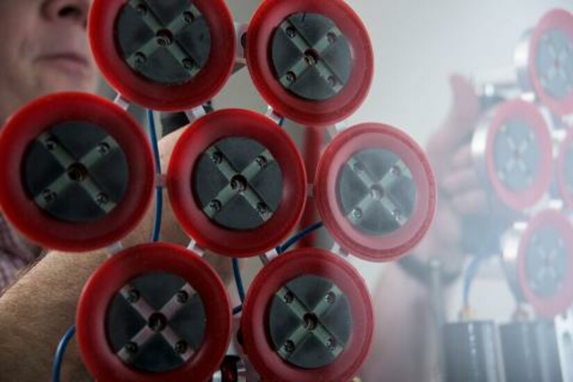 Close-up of Draper’s new climbing device with red pads featuring MicroHold material.