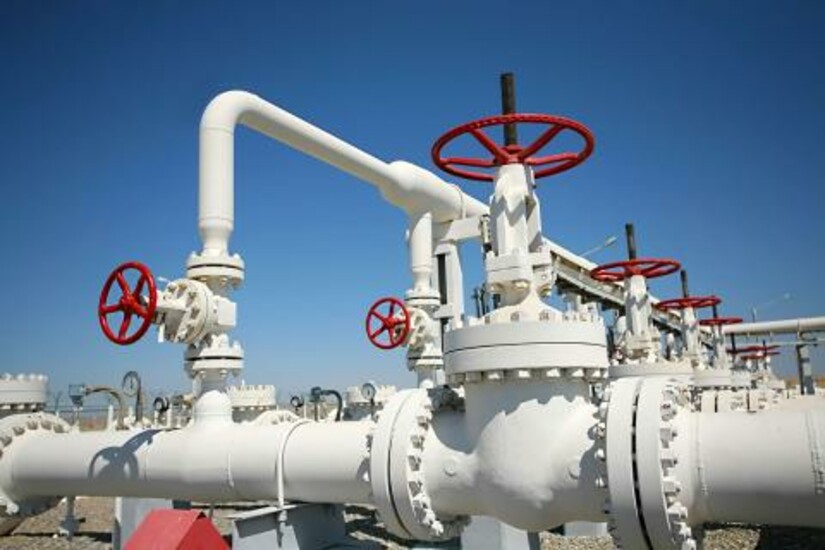 Pipelines with red valves used by oil and gas companies