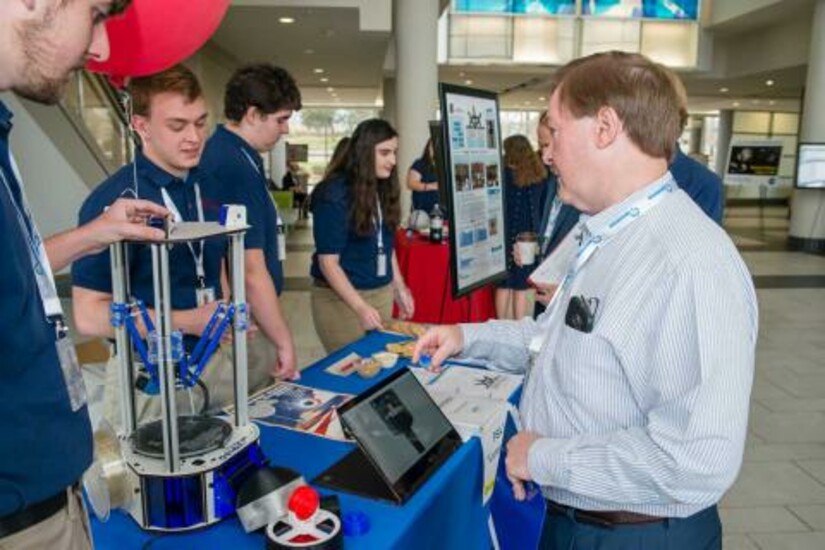 Students engage with Draper’s Huntsville office GM, Pete Paceley.