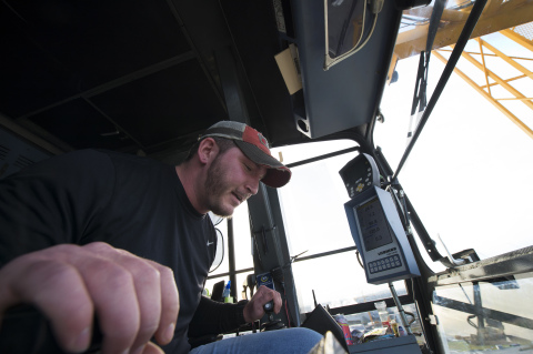 When Intel’s three-year water recycling plant construction is completed, crane operator Darren Starks estimates he’ll have spent a full year working from his tiny office-in-the-sky. Much of his time, says Starks, he is “fighting the wind” as he slings construction gear around the Hillsboro, Oregon, site. Any nervous moments 150 feet off the ground? Sweaty palms? “Never,” he says. (Credit: Walden Kirsch/Intel Corporation)